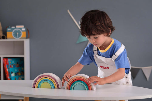 A beech wood stacking rainbow that builds fine motor skills, balance and hand-eye coordination through open-ended, screen-free play.